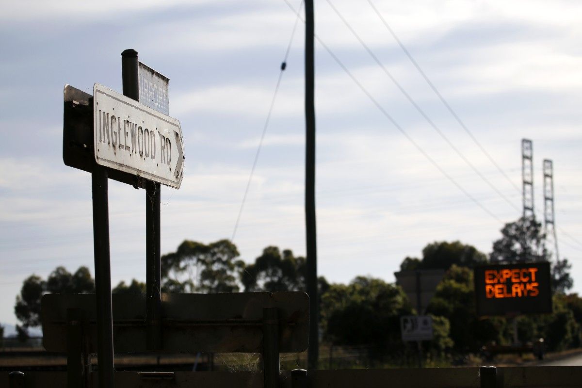 Inglewood Road sign in foreground with VMS board on background