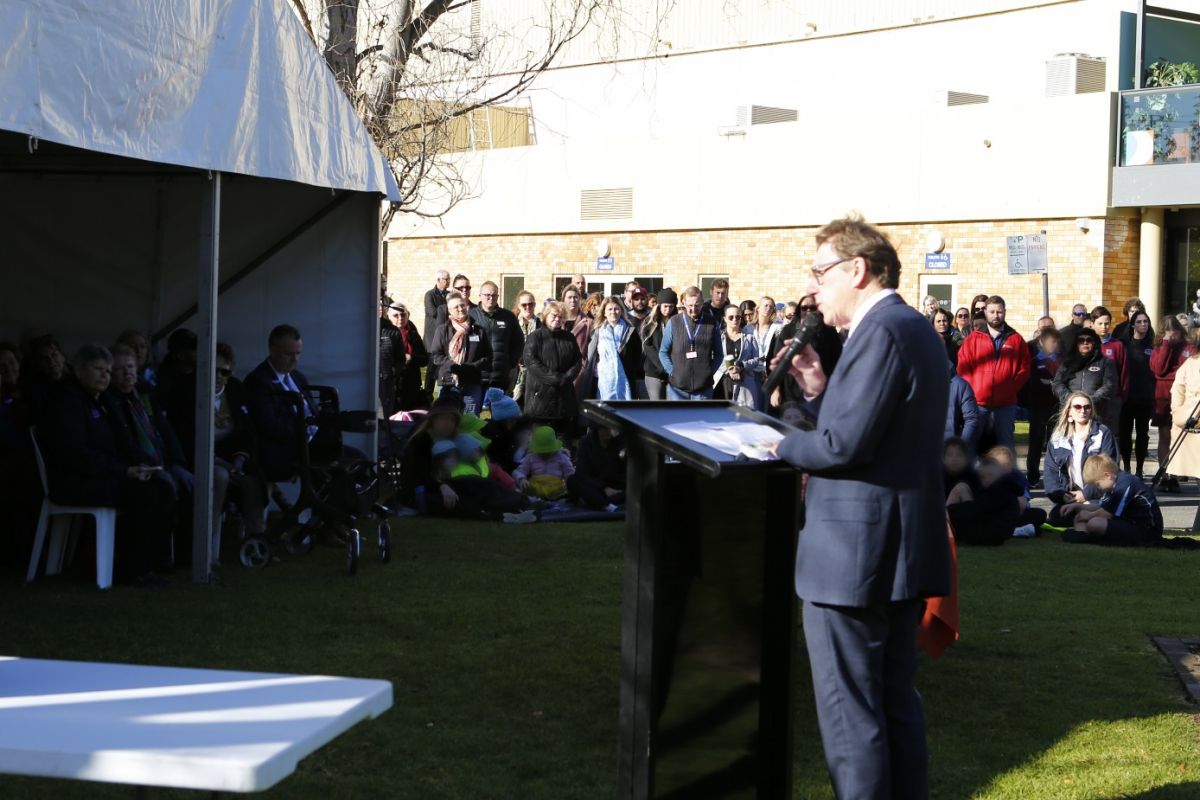 Man giving address to crowd at National Sorry day ceremony