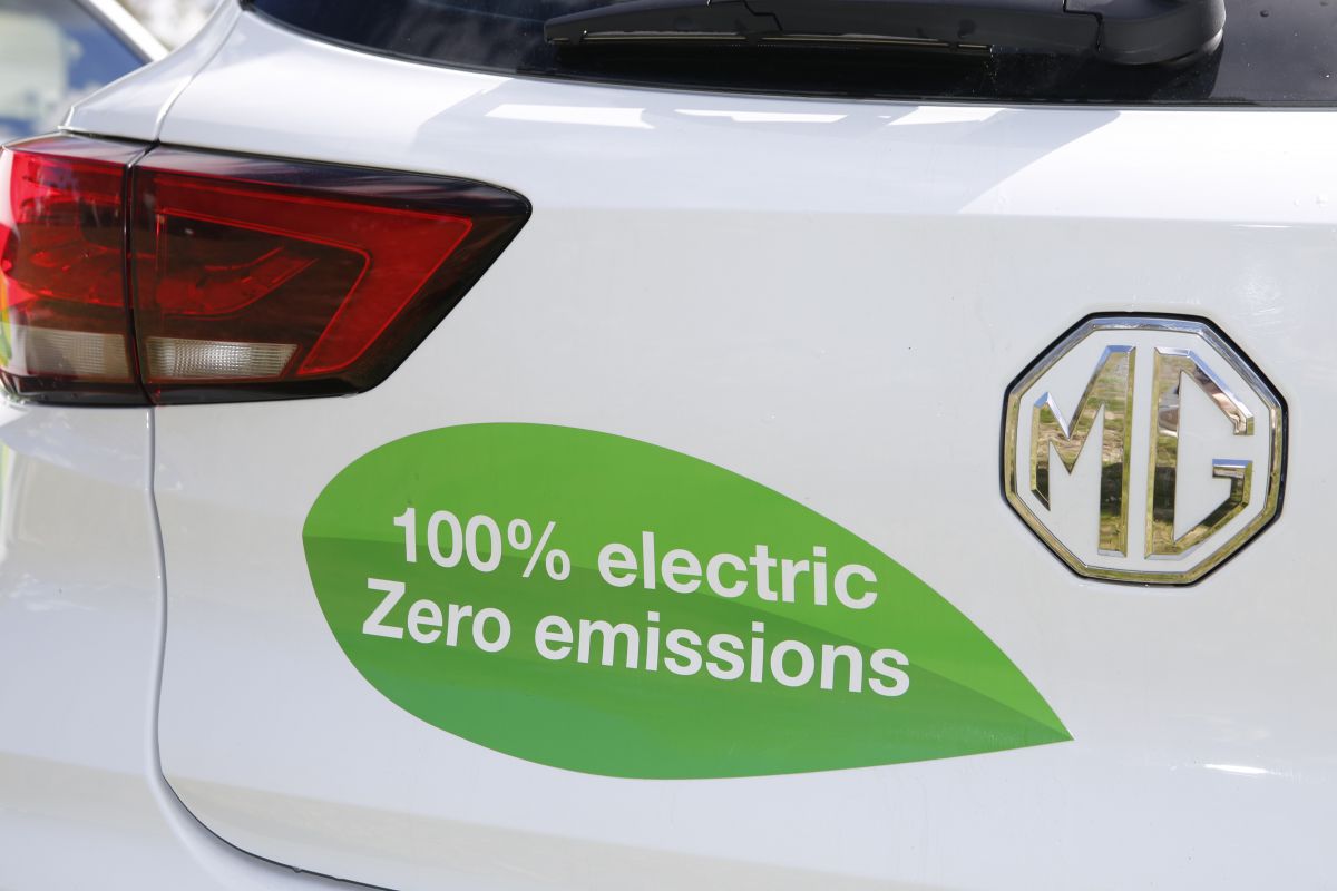 Close up on back of MG car showing green decal with text 'Zero Emissions'