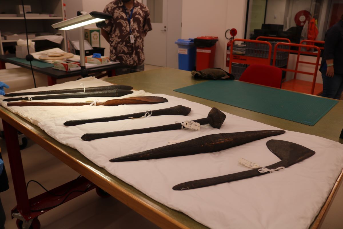 A table with Australian First Nations artefacts laid out. 