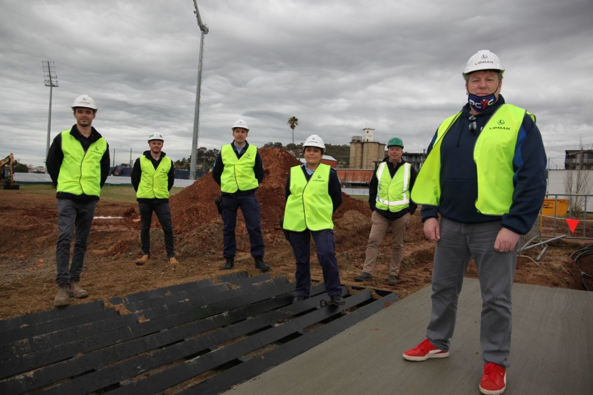 Group of people at building site