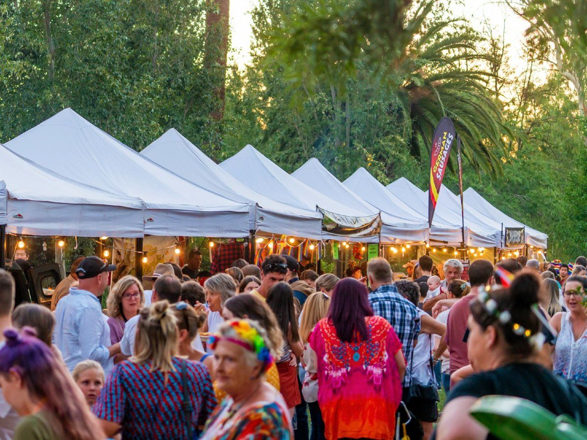 People in colourful outfits at gardens