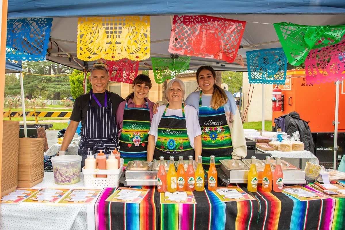 Man and three women at Fusion 22 stand