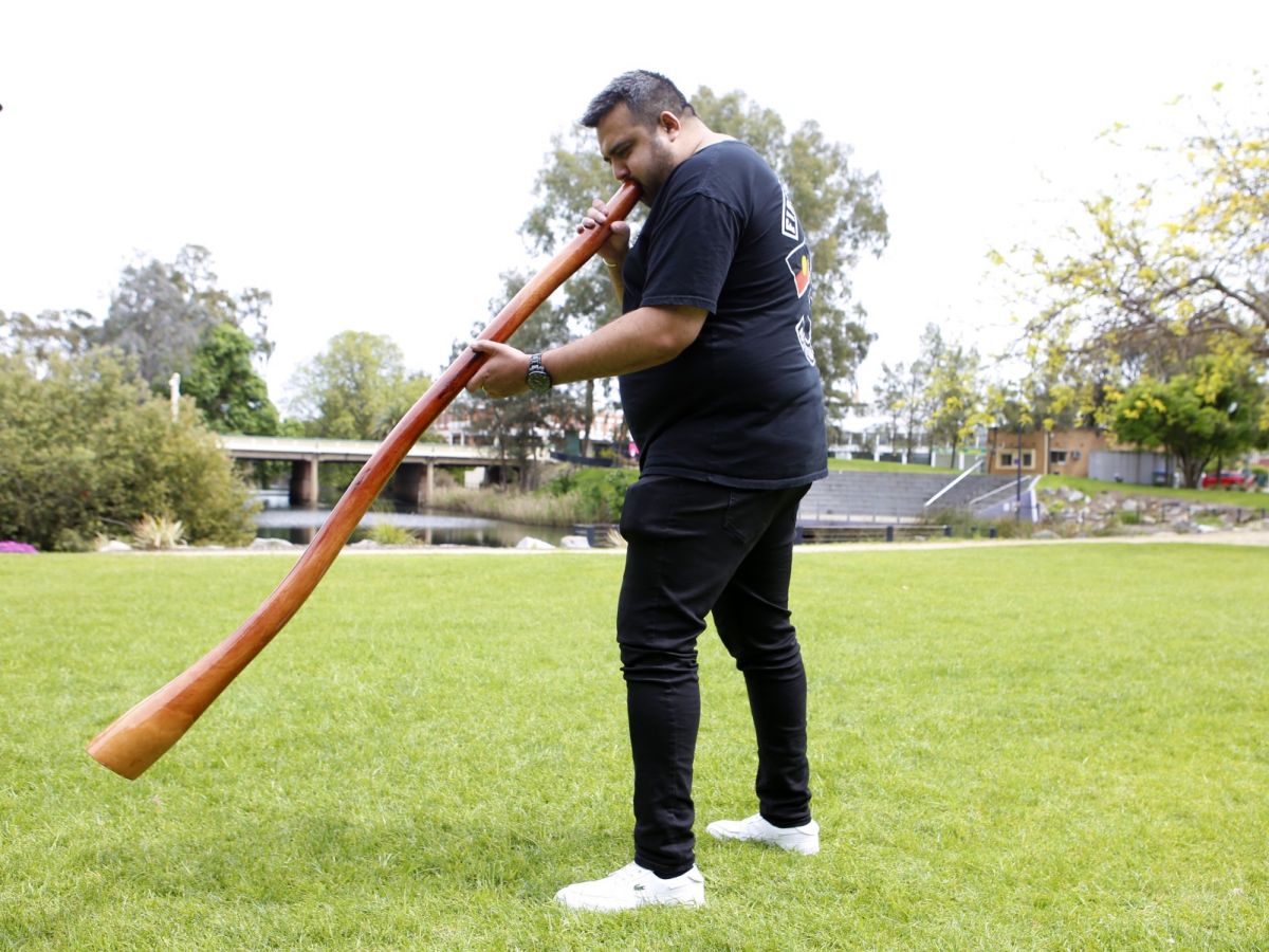 First Nation's comedian Dane Simpson playing the didgeridoo