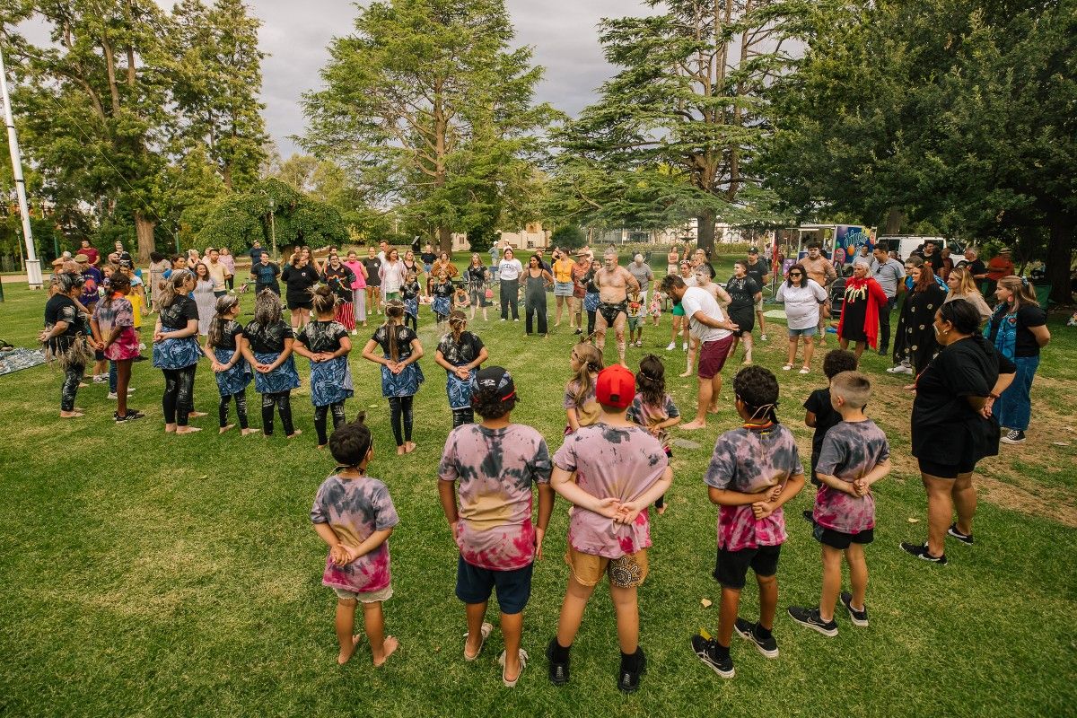 First nations performers on grass at Victory Memorial Gardens