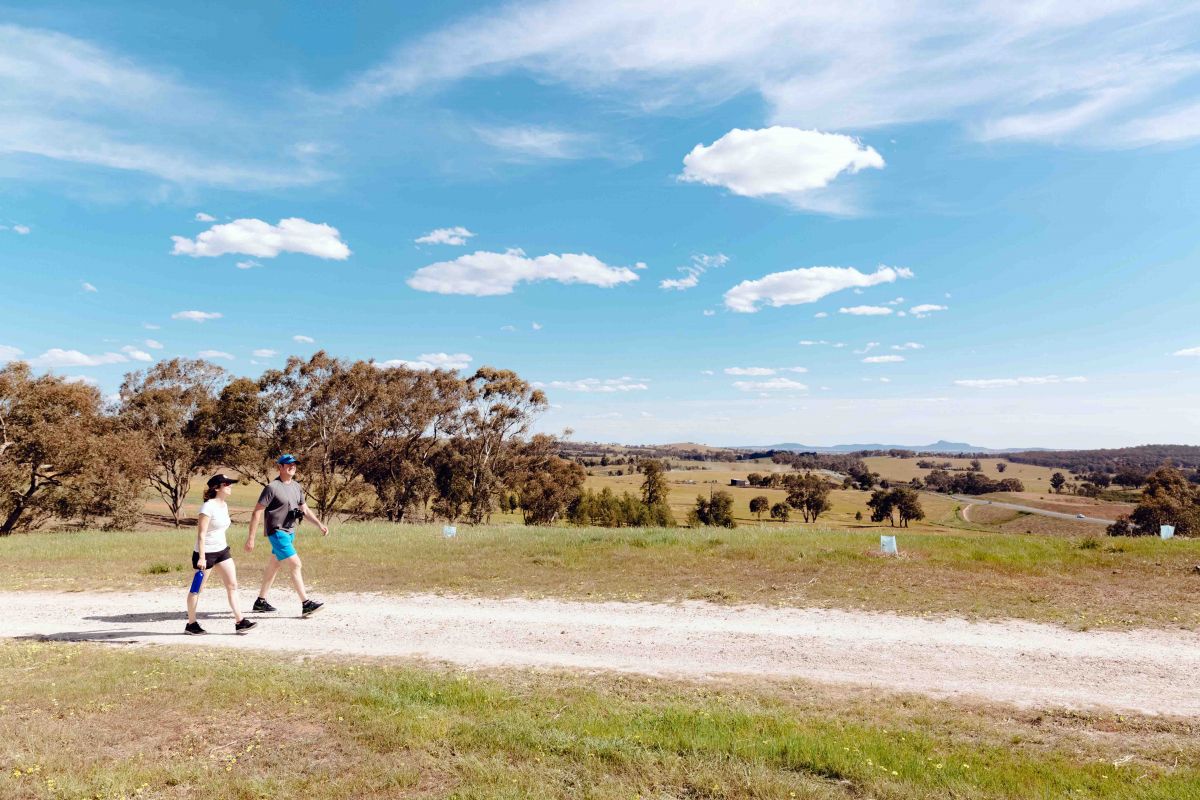 Woman and man walking on Wiradyuri Trail in Birramal Conservation Area