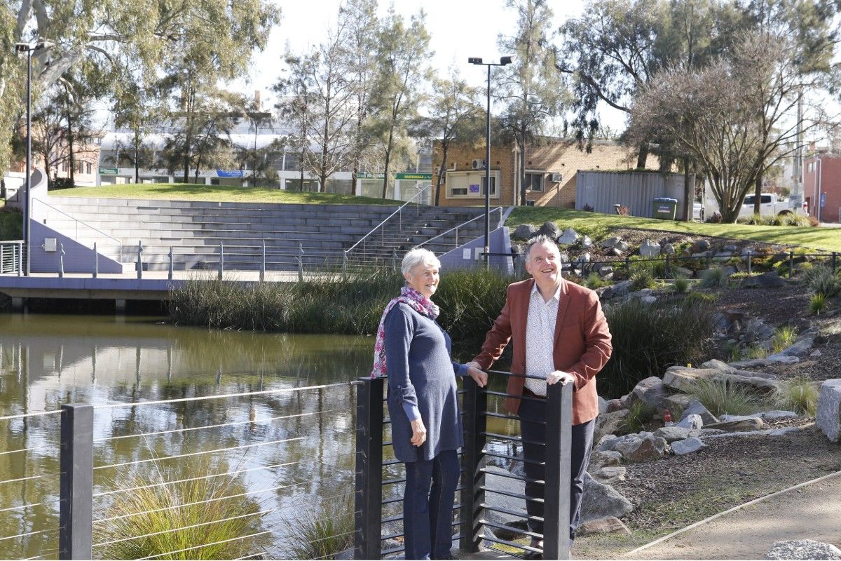 Man and woman standing on a platform overlooking the Wollundry Lagoon