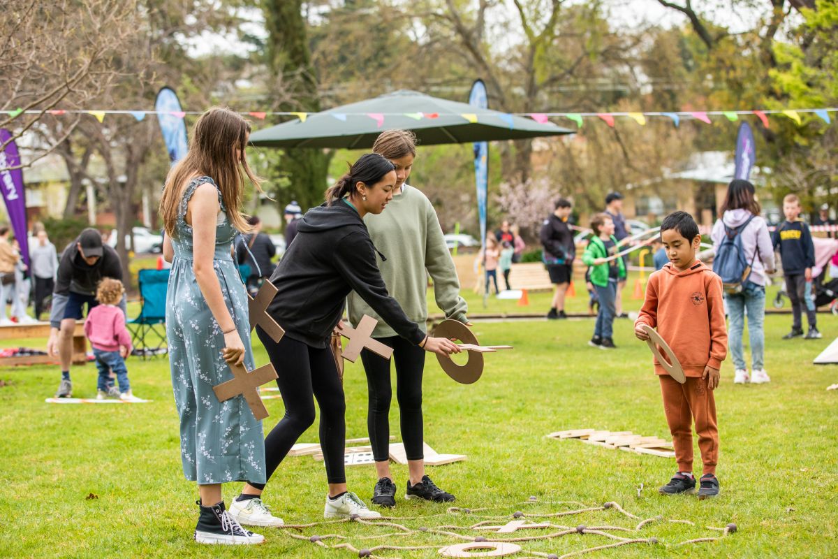 Wide shot of children using the games area at Spring Jam 2022.