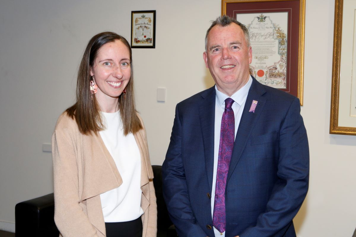 A man and a woman pose for a photo after being elected Mayor and Deputy Mayor (woman on left, man on right). 