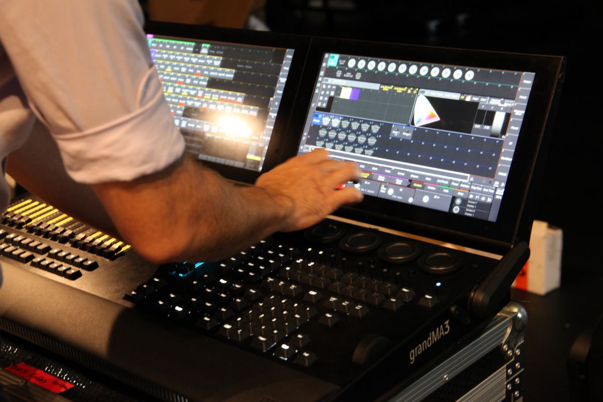 Show Technology expert controls the lighting desk.