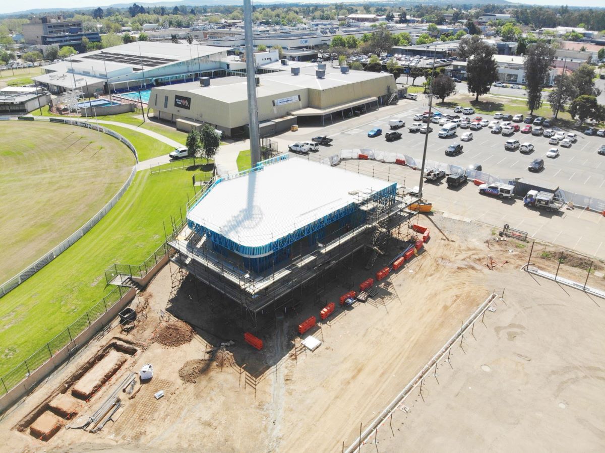 An aerial view of a construction site for a new tennis centre.