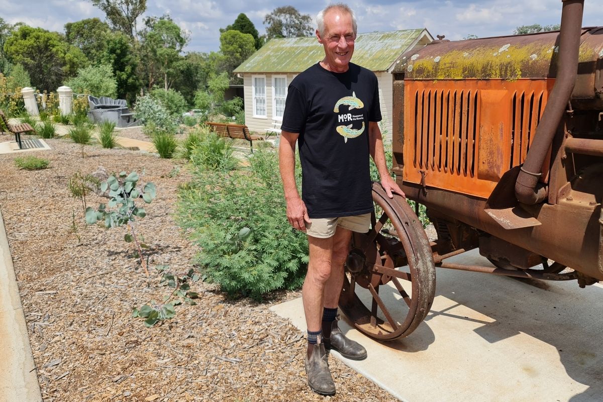 Museum Assistant Matthew Brassil with tractor in MoR's sustainable garden.