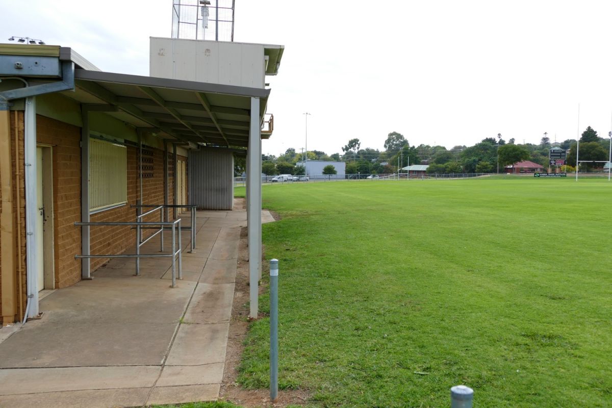 front veranda of brick amenities building facing sportsground.