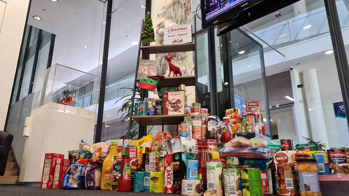 donated non-perishable food items stacked in pile