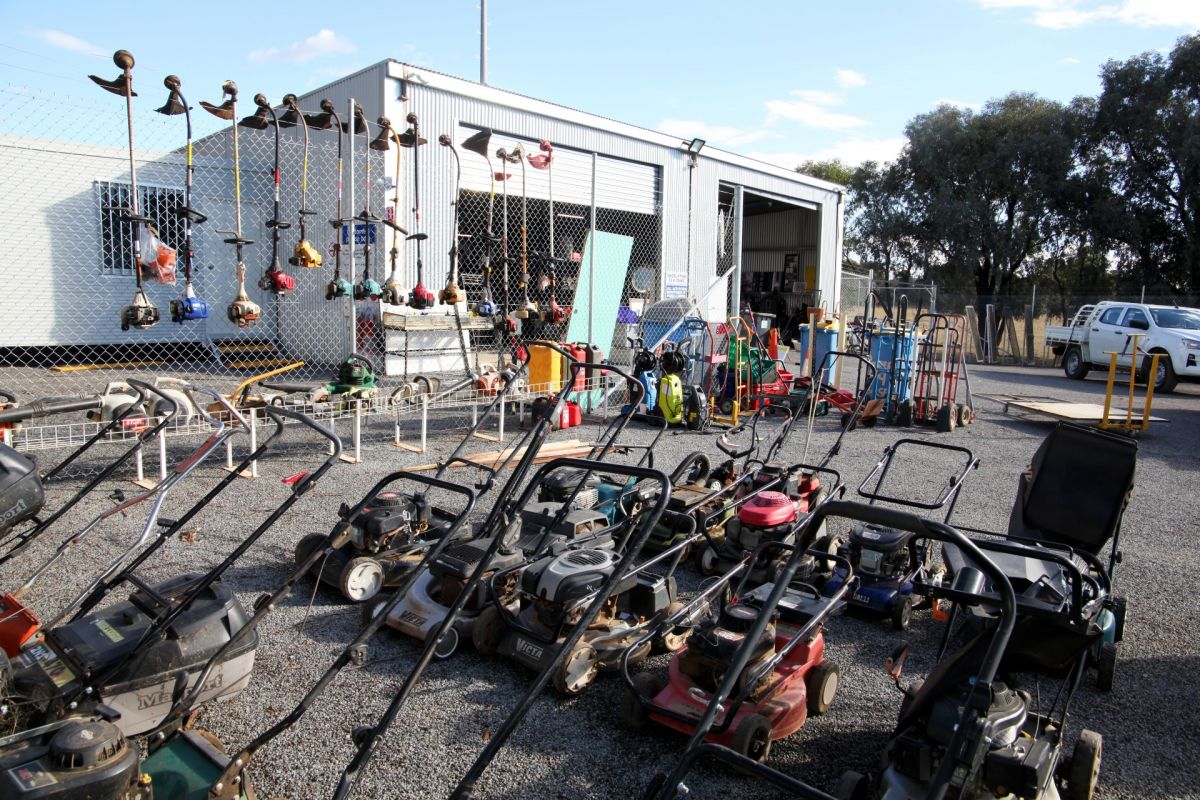 Tip Shop with carpark full of mowers, whipper snippers, gardening items