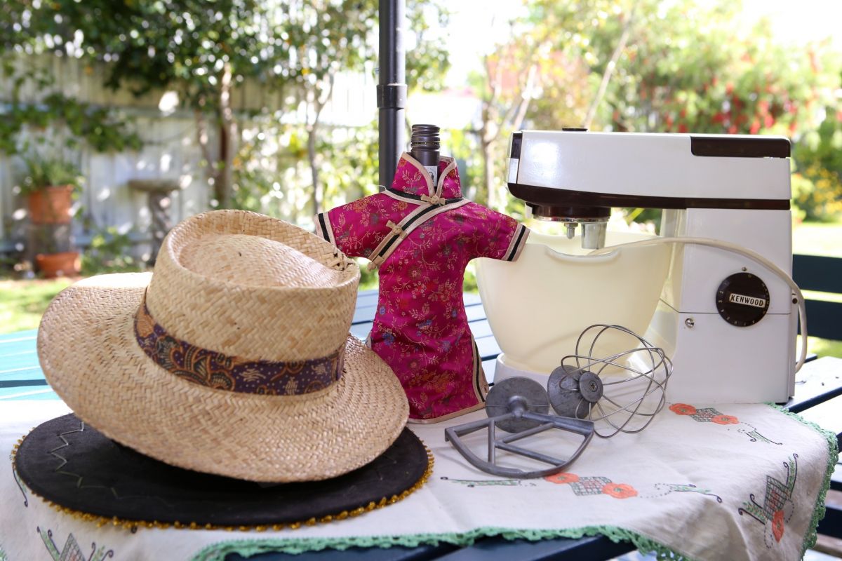 Old food mixer and hats on table