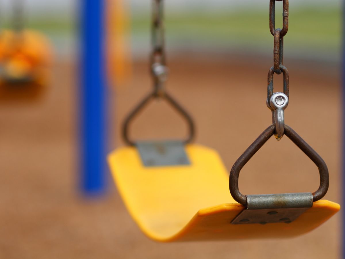 Empty swing at playground with blurred background