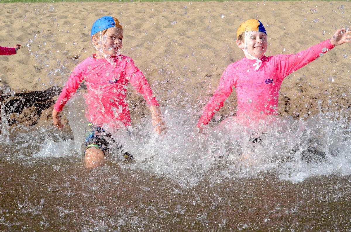 Kids run into water