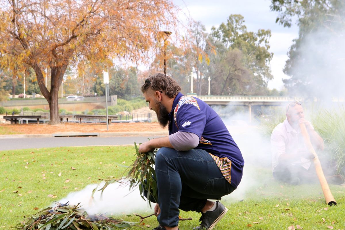 Wiradjuri man performing smoking ceremony