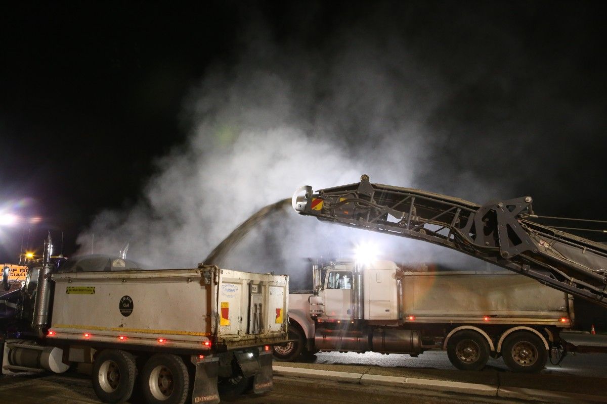 Trucks undertaking night road works 