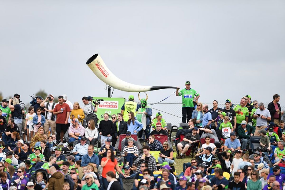 Raiders supporters in crowd at NRL game in 2022 at McDonalds Park