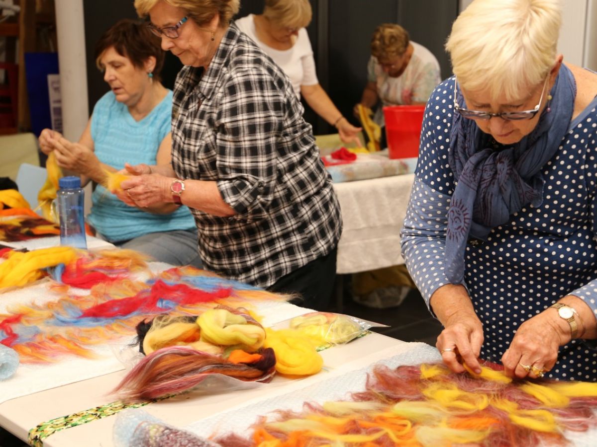 A group of women doing craftwork