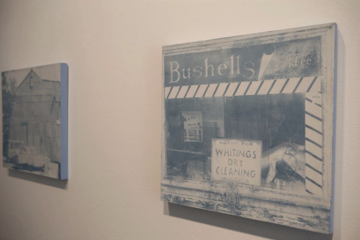 a close up of a cyanotype of an old shop front