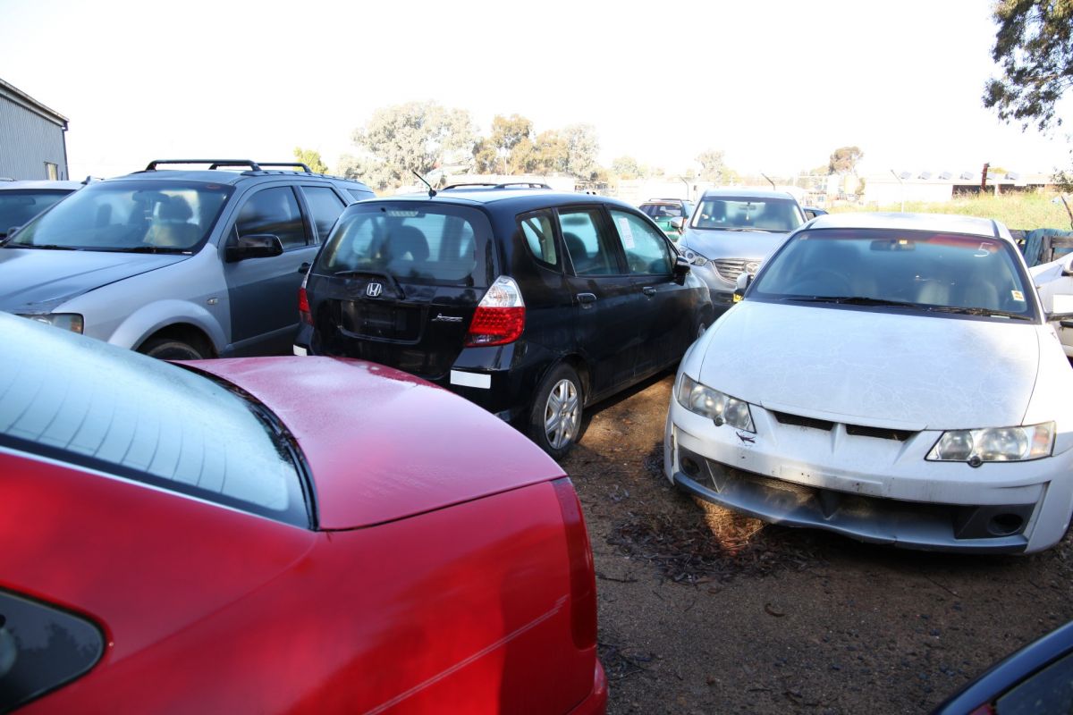 Impounded cars lined up in pound lot