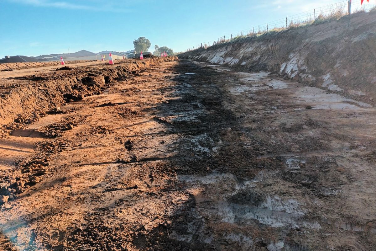 Earth works being carried out to widen road.