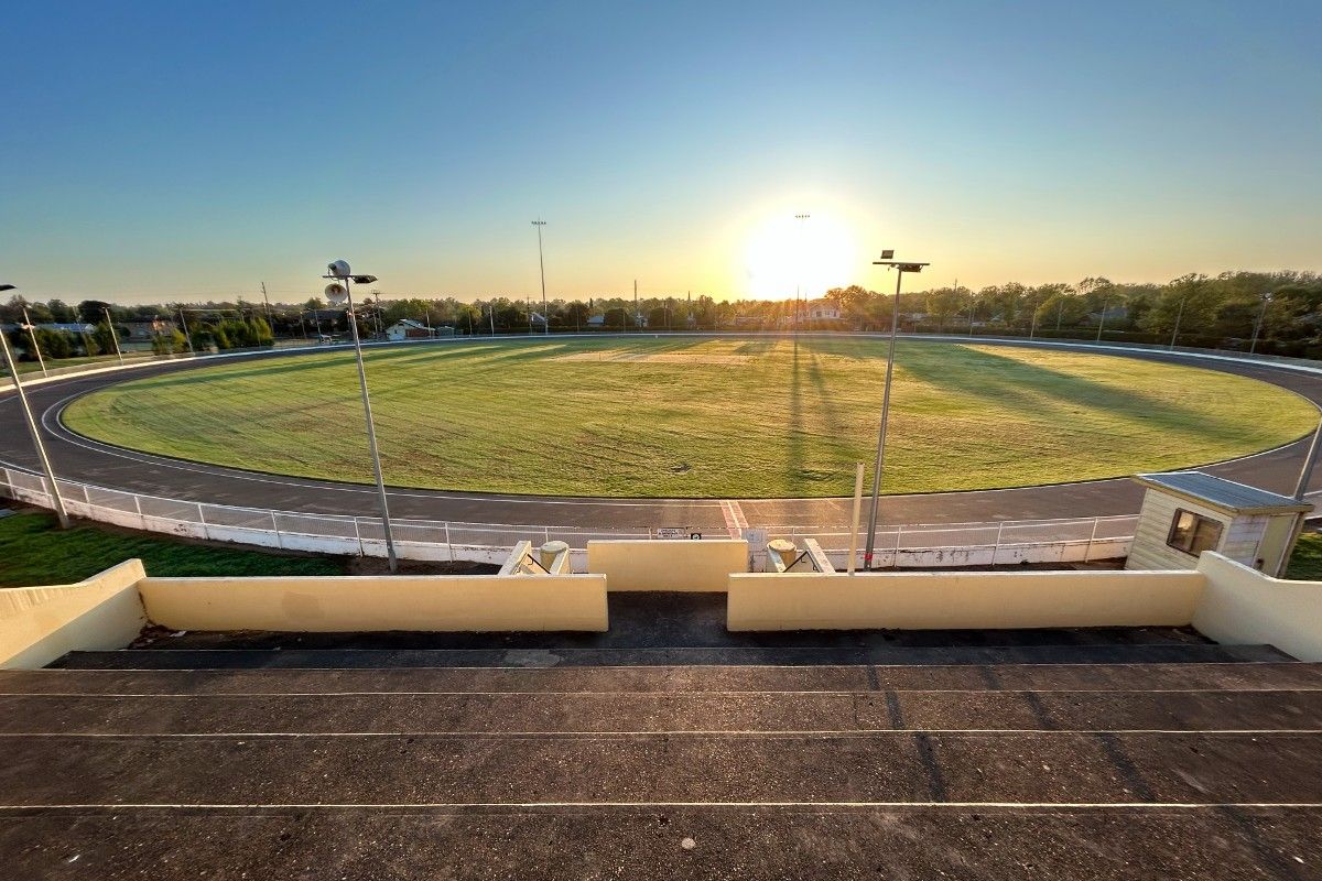 Wide view of Wagga Cricket Ground with a cycling track around the outside of the oval.