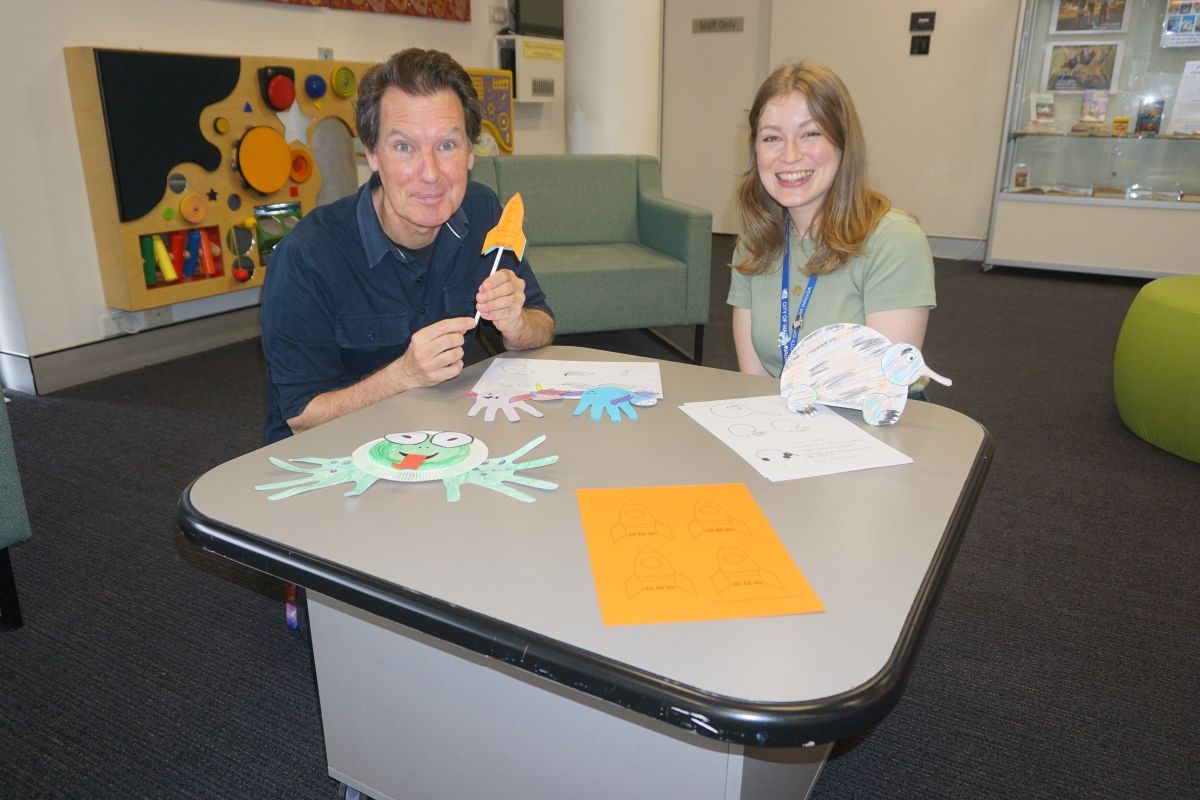 Senior Library Program Officer Catherine Greenslade and Library Programs Officer Peter Casey in Children's area of Wagga Wagga City Library