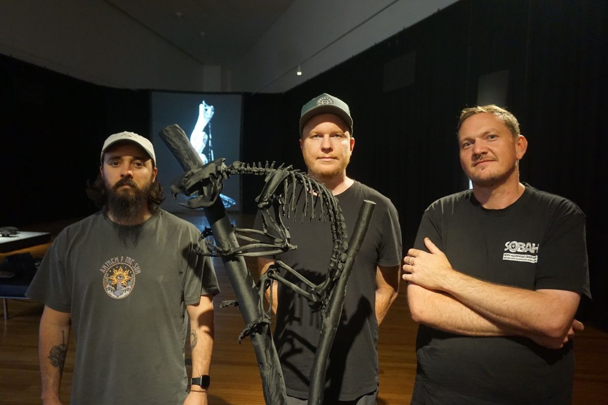 Local artists Damian Moloney, Timothy Crutchett and Christopher Orchard during installation of Understories for Gallery's Summer Exhibition