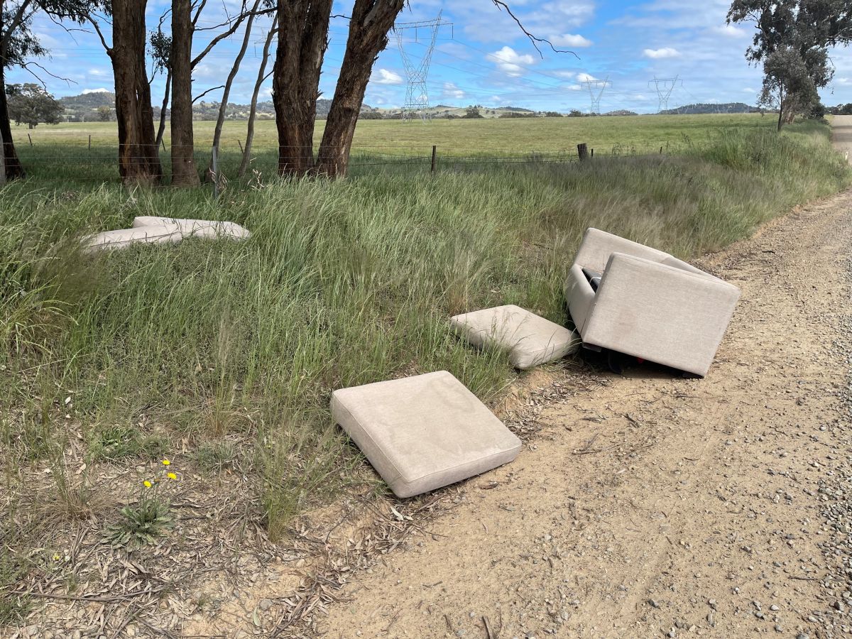 Counch dumped at the side of a rural road