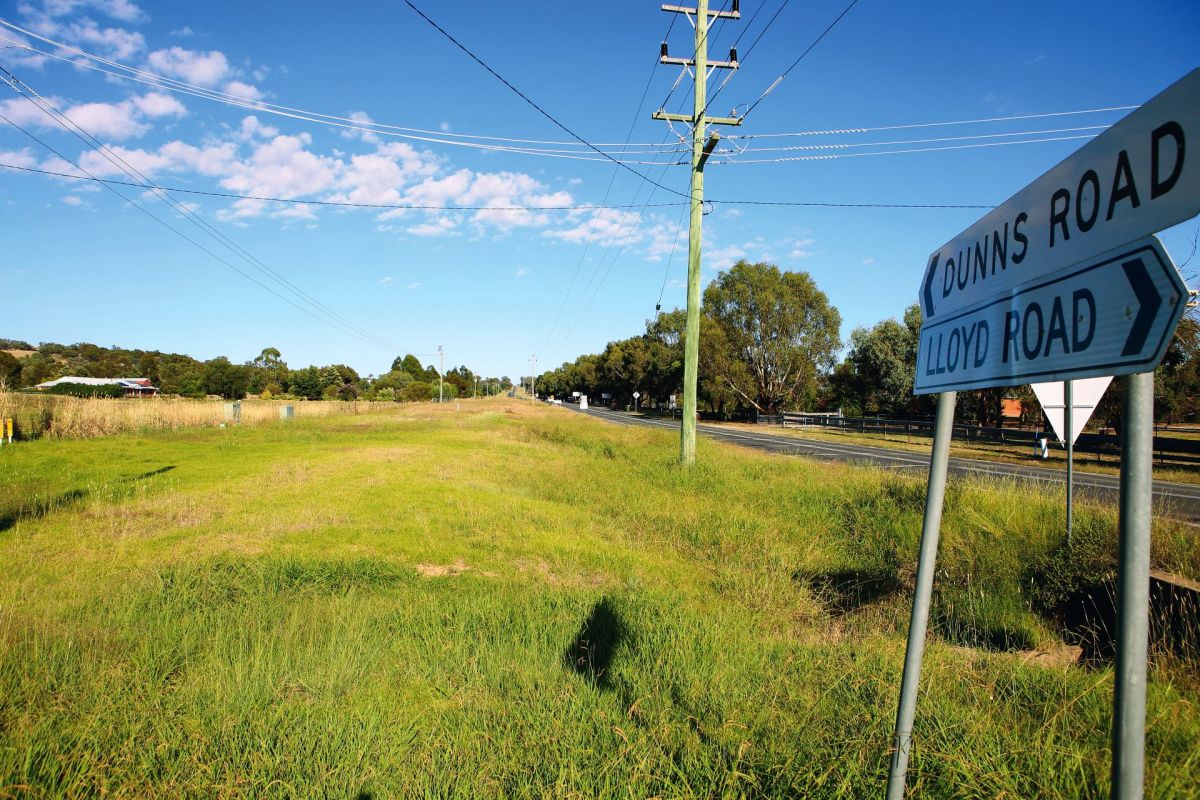 Road signs for Dunns & Lloyd Roads with Dunns Road in background