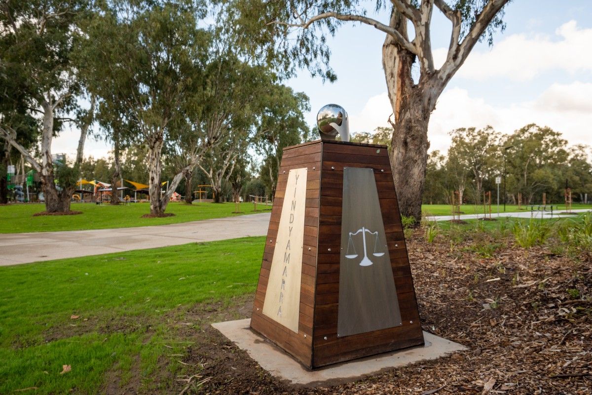 A sculpture in a parkland setting