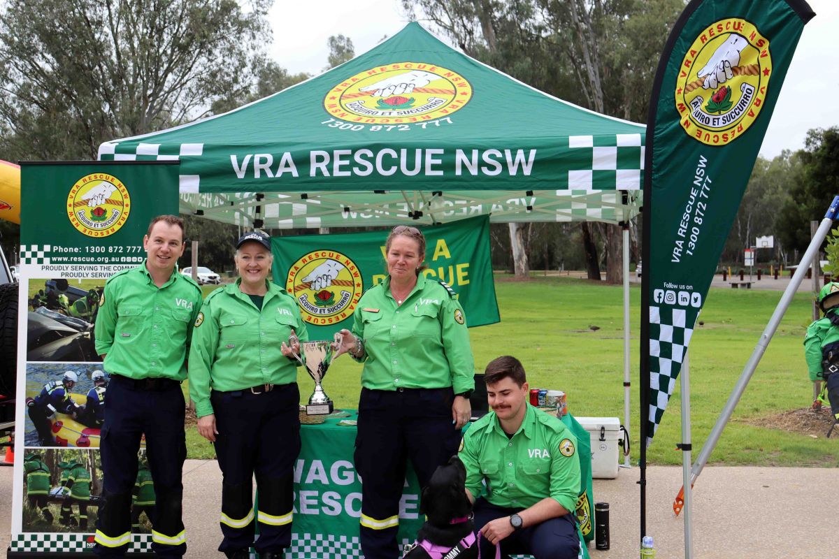 VRA volunteers holding up trophy