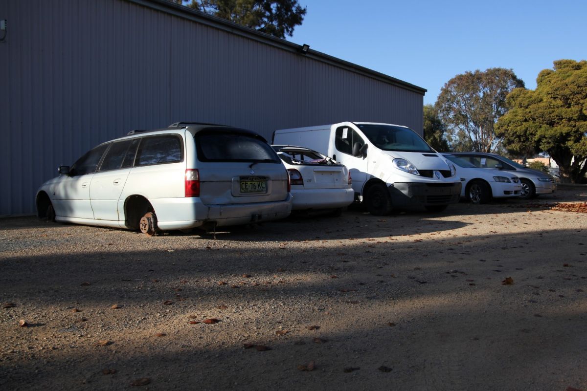 Impounded cars lined up in pound lot