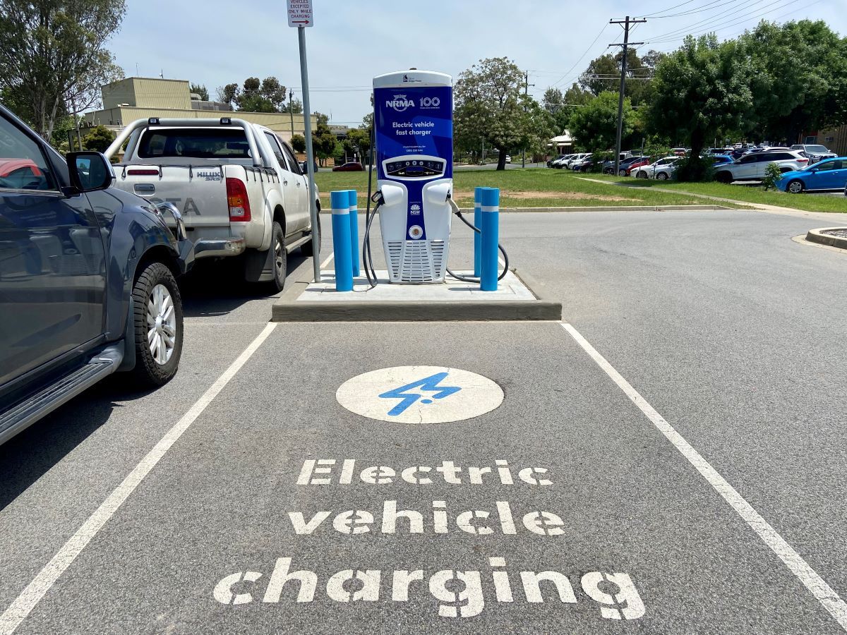 An electric vehicle charging station in a carpark