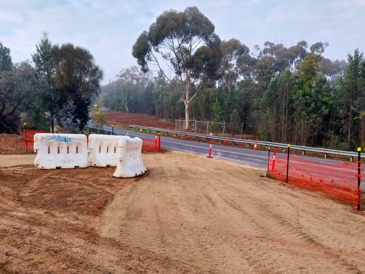 Temporary access road being constructed, with bunting along verge of road bunting 