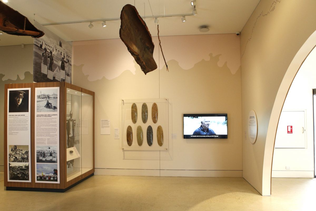 A museum setting with some First Nations objects on display. 