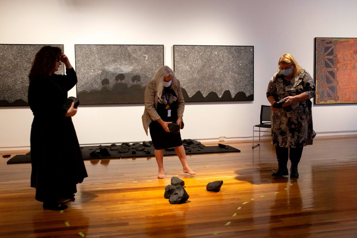 Wiradjuri elders lay rocks for art installation in VOID exhibition