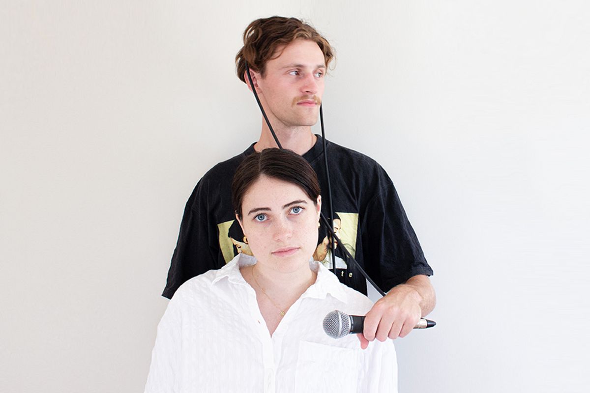 Man and woman against white backdrop