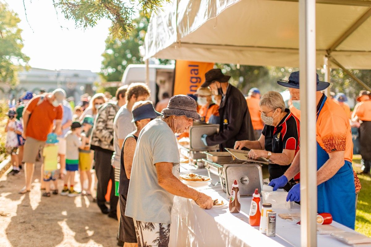 People lined up to get barbecue breakfast