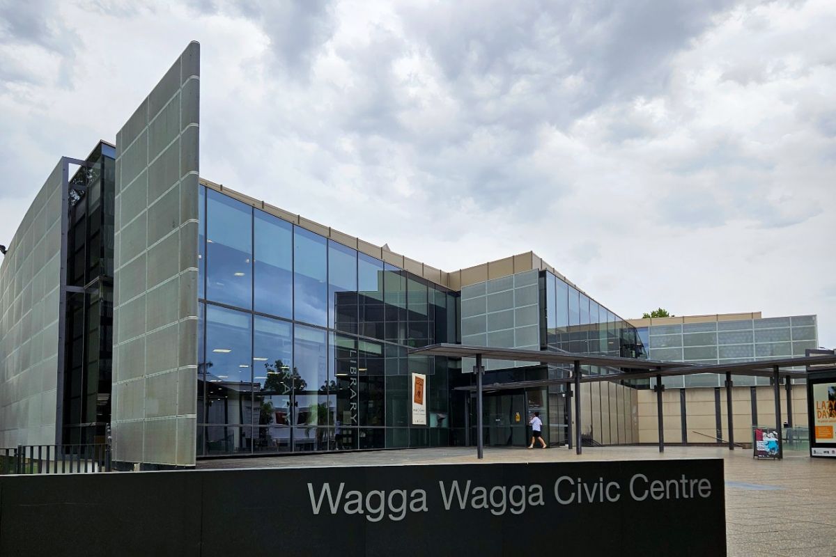 Exterior of Wagga Civic Centre building, with paved forecourt and glass walls