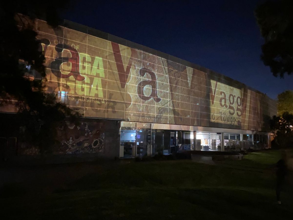 A projection on the side of a large building