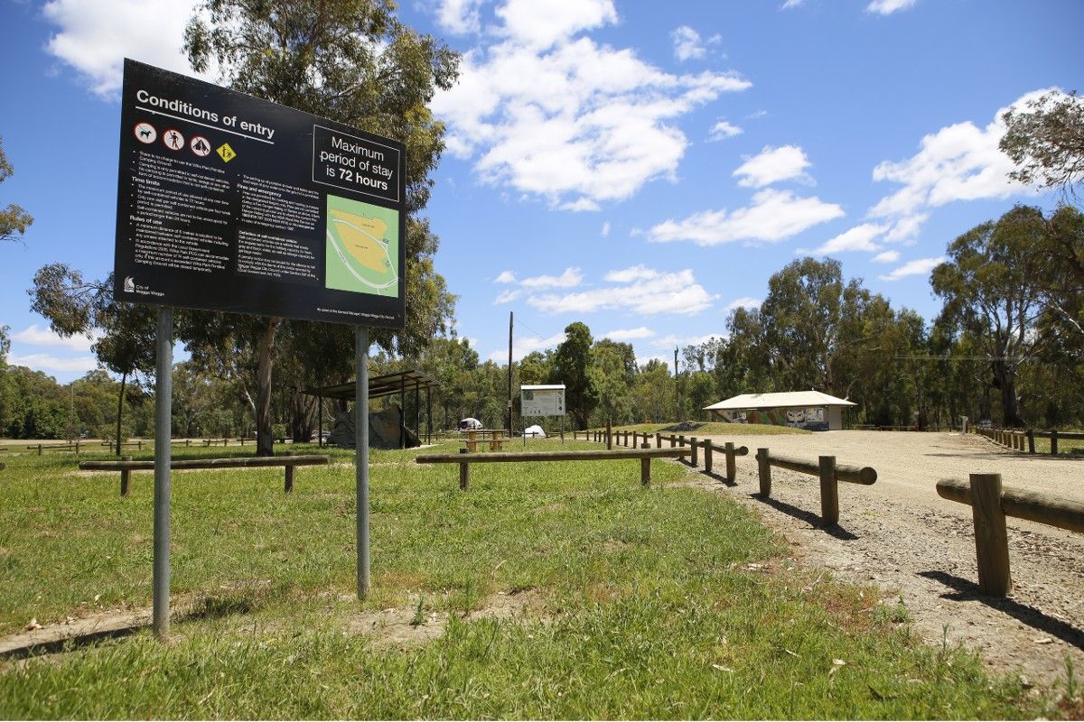 Wilks Park Conditions Sign in foreground with amenities block in background