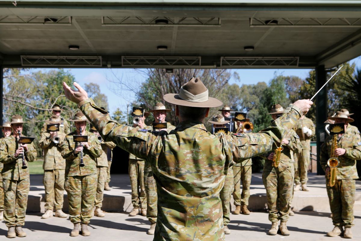 Officer Commanding and Music Director, Australian Army Band Kapooka Major Greg Peterson conducting the band