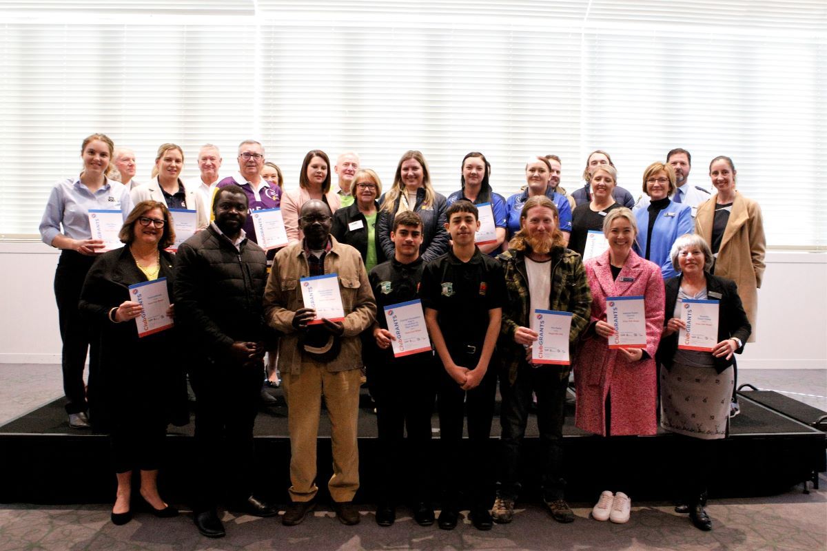 Deputy Mayor Cr Amelia Parkins, and representatives from the Wagga RSL Club and Rules Club Wagga with the successful ClubGRANTS recipients in 2023, standing together with certificates.