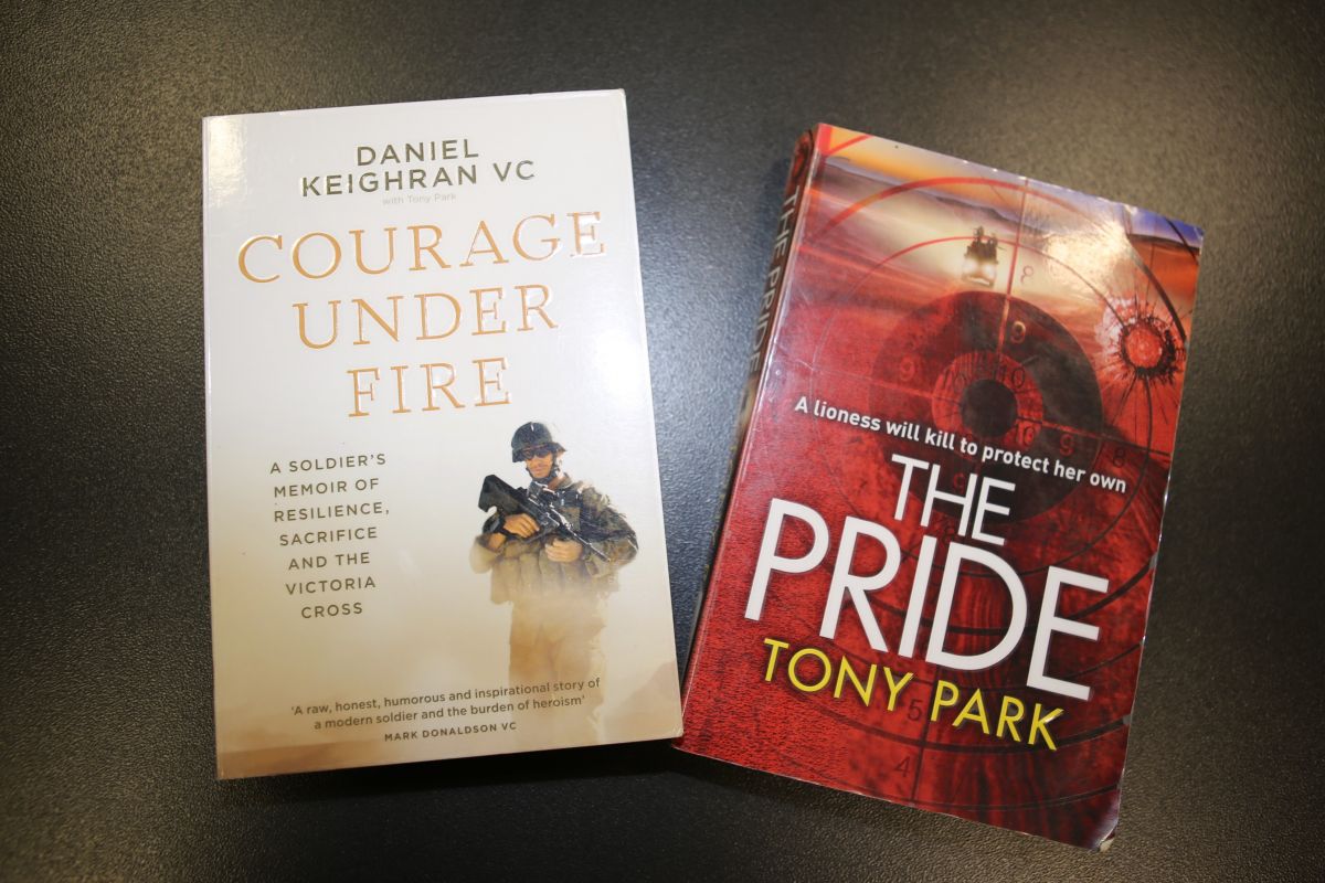 A close-up of two novels. 