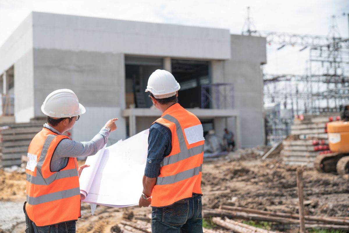 Builders assess work site